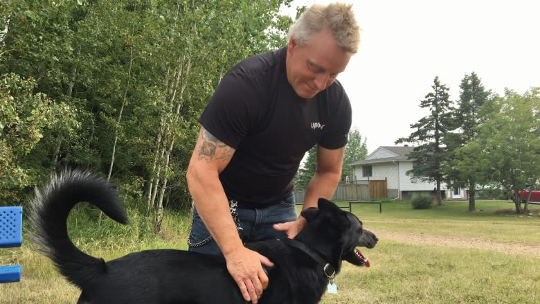 Dog wakes owner before Alberta home burns down — again