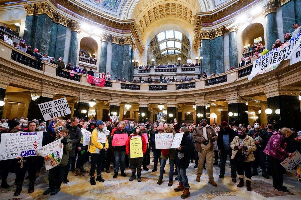 Protesters are seen in the Wisconsin Capitol Rotunda during a march supporting overturning Wisconsin's near total ban on abortion Sunday, Jan. 22, 2023, in Madison, Wis.