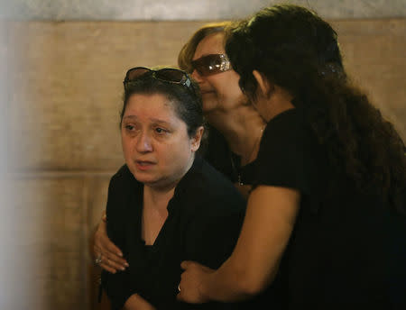 Relatives of the Christian victims of the crashed EgyptAir flight MS804 react during an absentee funeral mass at the main Cathedral in Cairo, Egypt, May 22, 2016. REUTERS/Mohamed Abd El Ghany