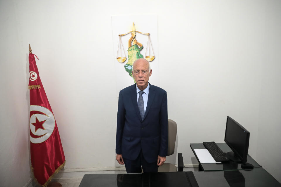 Tunisian former conservative constitutional law professor Kais Saied stands in his office in Tunis, Tunisia, Tuesday, Sept. 17, 2019. With more than half the votes in Tunisia's presidential race counted, Kais Saied was in the lead. Media magnate Nabil Karoui, a more modernizing candidate, was in second place with 15.5%. (AP Photo/Mosa'ab Elshamy)