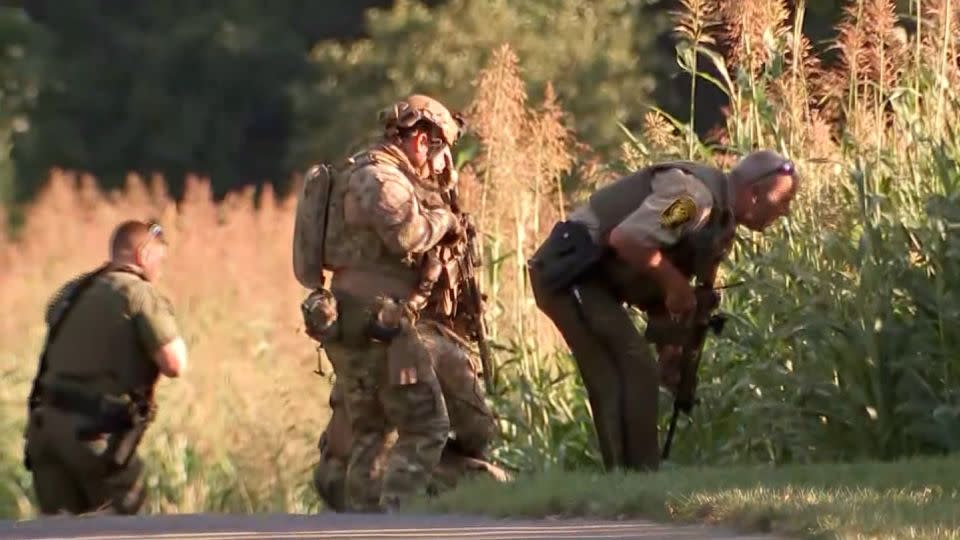 Law enforcement officials search for Danelo Cavalcante on August 31 in West Chester, Pennsylvania. - KYW