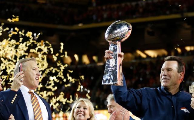 Photo: Denver Broncos Head Coach Gary Kubiak holds the Lombardi