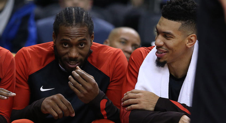 Danny Green and Kawhi Leonard share a laugh on the bench. (Steve Russell/Toronto Star via Getty Images)