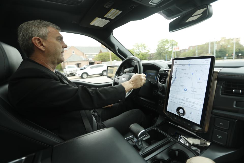 Kel Kearns, the Tennessee Electric Vehicle Center plant manager for Ford’s BlueOval City, drives the F-150 Lightning in Downtown Memphis on Friday, April 14, 2023.