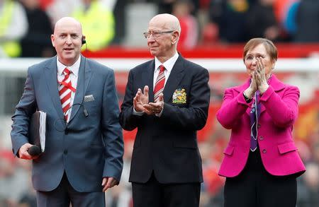 Football Soccer - Manchester United v Everton - Barclays Premier League - Old Trafford - 3/4/16 Sir Bobby Charlton and wife Norma applaud fans as the newly renamed South Stand "Sir Bobby Charlton stand" is unveiled to commemorate the 60 year anniversary of his debut for Manchester United Reuters / Phil Noble Livepic EDITORIAL USE ONLY.