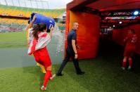 England head coach Mark Sampson is dunked with ice water by his players following their defeat of Germany in the third place match of the FIFA 2015 Women's World Cup at Commonwealth Stadium. England defeated Germany 1-0 in extra time. Mandatory Credit: Erich Schlegel-USA TODAY Sports