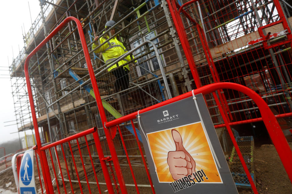 A Barratt employee walks down scaffolding at a Barratt housing development near Haywards Heath, Britain, February 20, 2020. REUTERS/Peter Nicholls