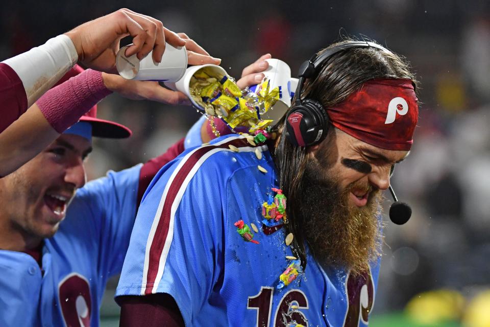 Phillies outfielder Brandon Marsh (16) has water and bubble gum dumped on him by second baseman Bryson Stott (5) and third baseman Alec Bohm (28) after win against the Pittsburgh Pirates at Citizens Bank Park in which all three homered Thursday.