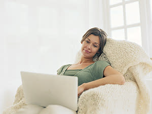 woman at home on computer