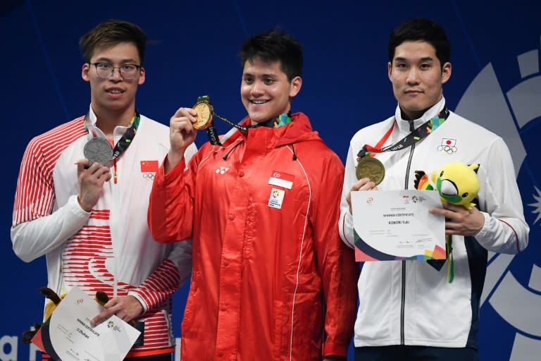 Singapore's Joseph Schooling broke the stranglehold of China and Japan, who had hitherto won every gold medal on offer, by retaining his Asian crown in the 100 metres butterfly