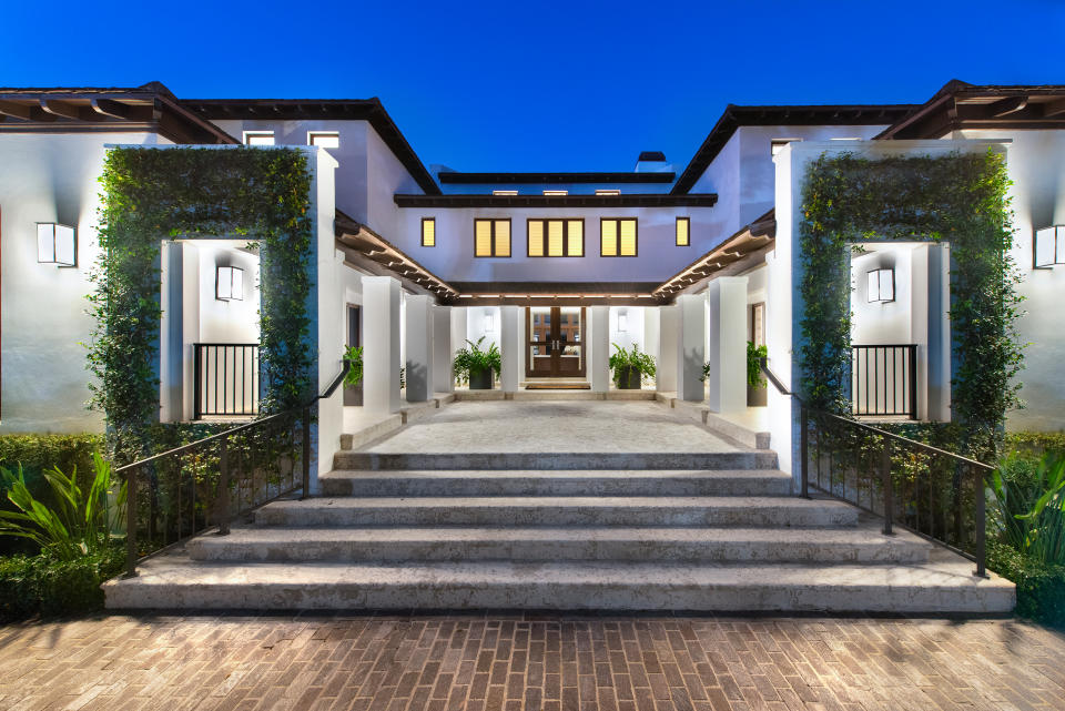 The home has coffered ceilings, elegant chandeliers, multiple terraces and French doors. Photo by: Platinum Luxury Auctions.