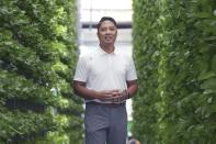 Eden Green Technology chief executive officer Eddy Badrina poses for a photo in a greenhouse in Cleburne, Texas, Aug. 29, 2023. Badrina says the company has figured out a way to rely mostly on natural light for their plants. (AP Photo/LM Otero)