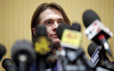 Raffaele Sollecito smiles as he leads a news conference in Rome March 30, 2015. REUTERS/Max Rossi