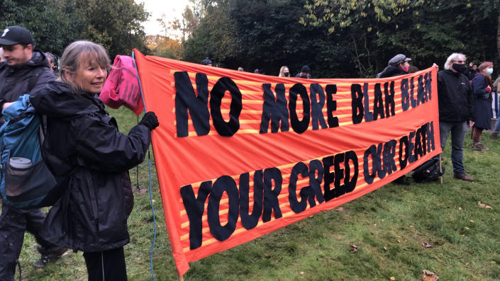 British activists hold up a banner reading &#x00201c;No more blah blah, your greed our death&#x00201d; at a rally for more aggressive action to combat climate change during the United Nations climate summit in Glasgow, Scotland.