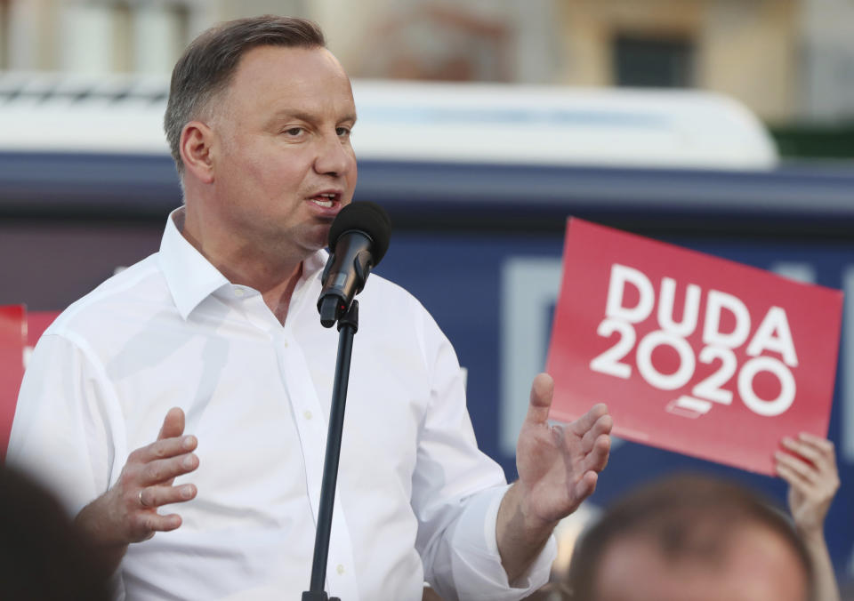 In this Tuesday, July 7, 2020 photo Poland's incumbent president Andrzej Duda, who is seeking reelection in a tight presidential election runoff on Sunday, July 12, 2020 attends a rally in Lomza, Poland. Duda, who has backing from Poland's ruling right-wing party, is running against liberal Warsaw mayor, Rafal Trzaskowski. Opinion polls suggest the election may be decided by a small number of votes. (AP Photo/Czarek Sokolowski)