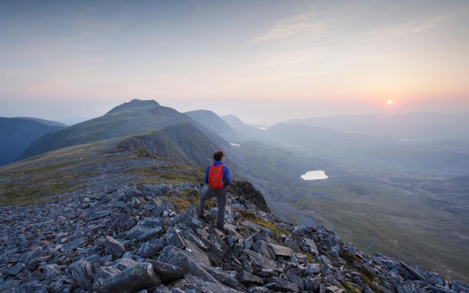 Hillwalker on Cadair Idris at sunset