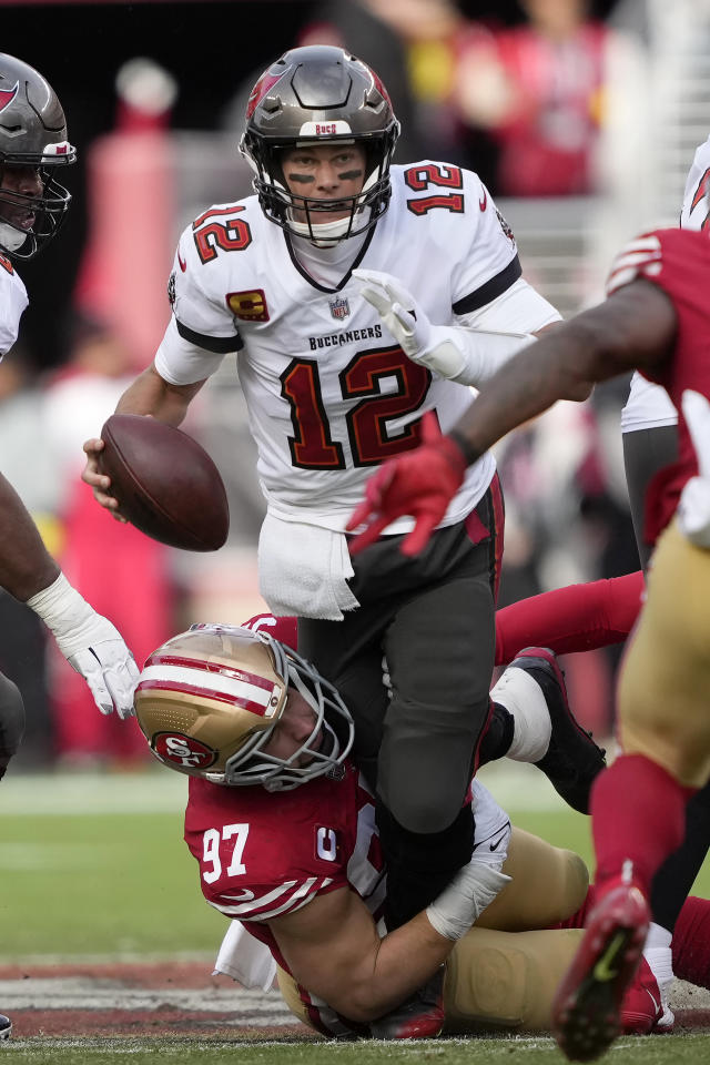 Tampa Bay Buccaneers quarterback Tom Brady (12) hugs Seattle