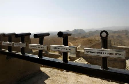 Location and range information is seen on a wall in the Kitton outpost along the border fence on the border with Afghanistan in North Waziristan, Pakistan October 18, 2017. REUTERS/Caren Firouz