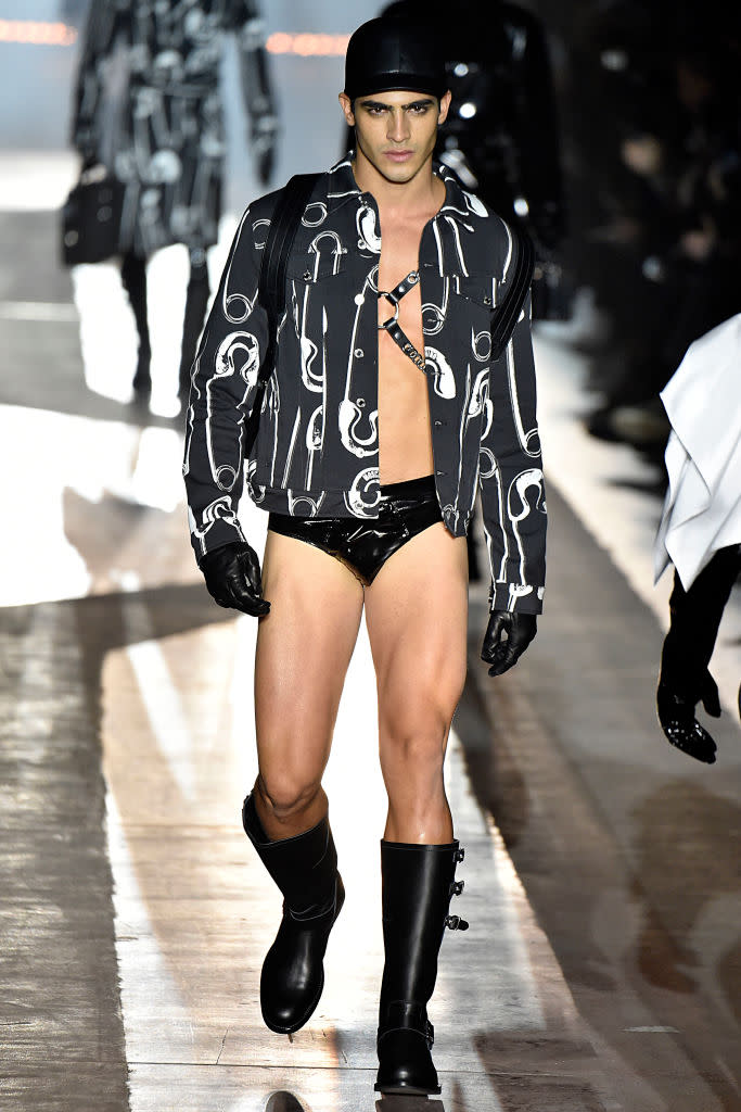 Designer Jeremy Scott, presenting his new collection for Moschino’s fall 2018 menswear collection, has brought fetish back to fashion. (Photo: Getty Images)