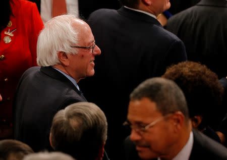 U.S. Democratic presidential candidate Senator Bernie Sanders (L) arrives on the floor of the House of Representatives before U.S. President Barack Obama's State of the Union address to a joint session of Congress in Washington, January 12, 2016. REUTERS/Carlos Barria