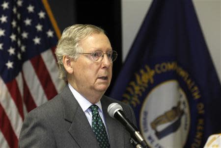 Senator Mitch McConnell (R-KY) talks with attendees before the presentation of a Purple Heart at the VFW Post 1170 in Louisville, Kentucky, April 5, 2014. REUTERS/John Sommers II