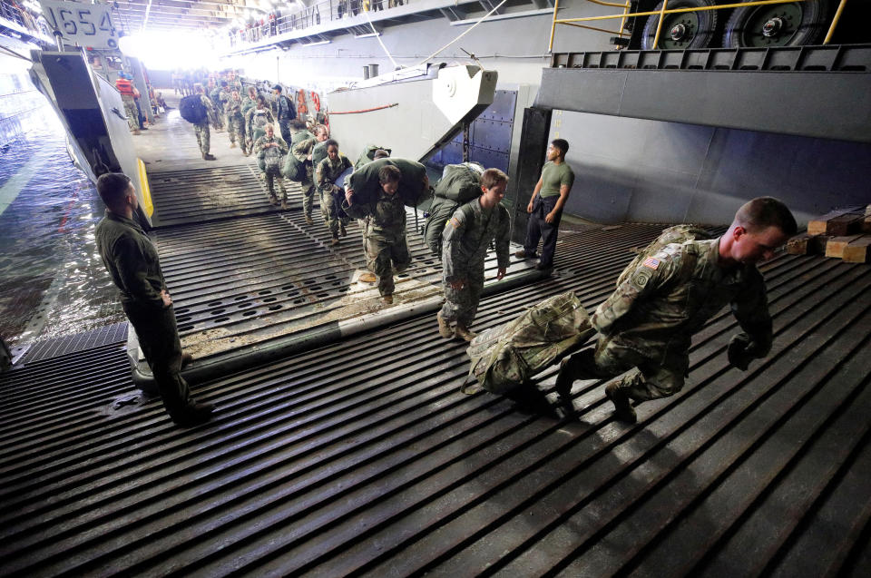 <p>The Army’s 602nd Area Support Medical Company boards the U.S.S. Kearsarge aircraft carrier from a Navy landing craft during their evacuation from the U.S. Virgin Islands in advance of Hurricane Maria, Sept.17, 2017. (Photo: Jonathan Drake/Reuters) </p>