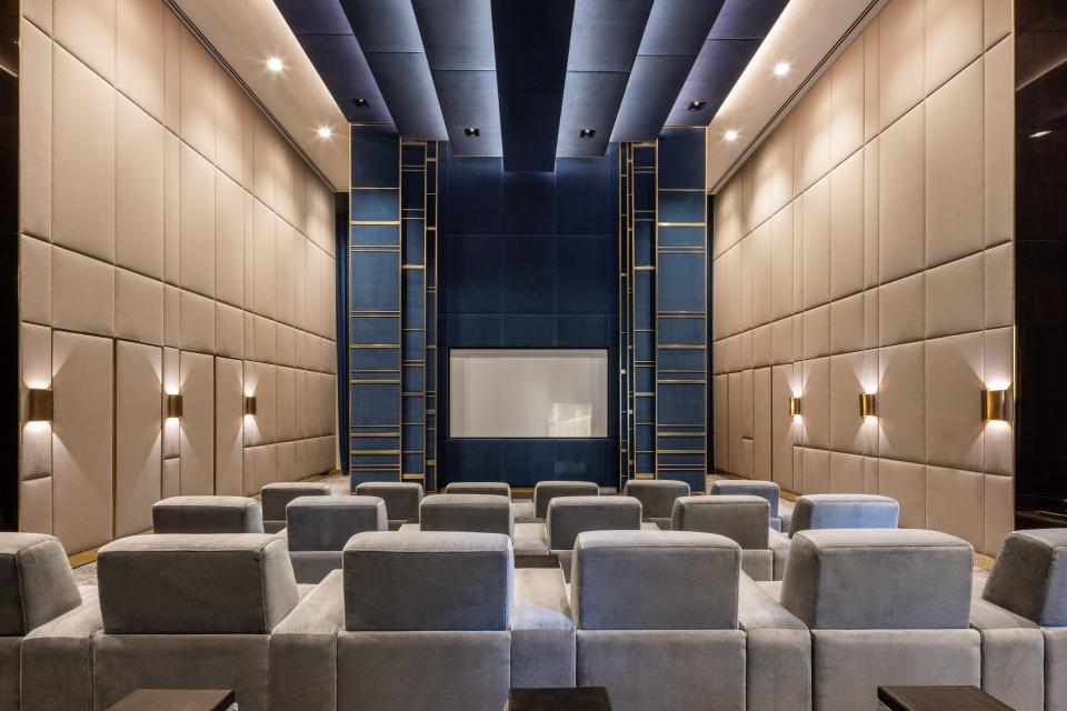 gray seats in a movie theater on the 14th floor of luxury skyscraper Central Park Tower