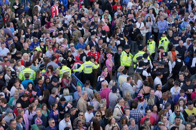 Police officers managing the crowd congestion during the Coronation Concert.