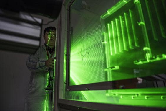 A Huawei thermal engineer performs a heat test in the research and development area of the Bantian campus (Getty Images)