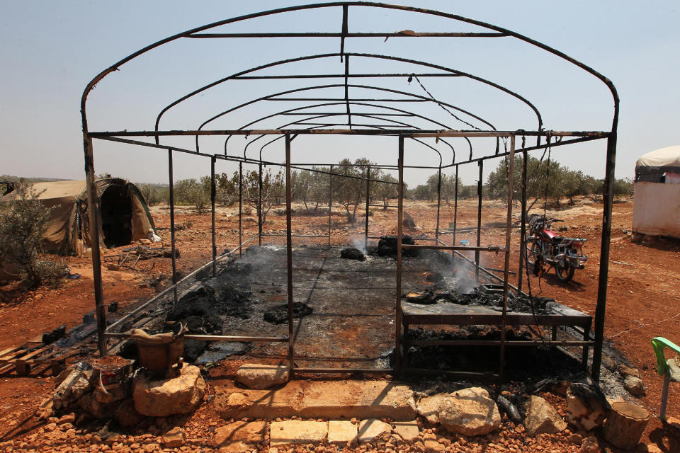 Burnt tent for displaced people in Syria