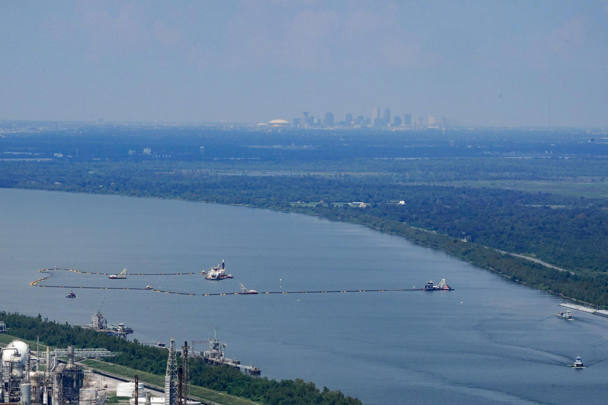 An aerial view of dredging operations to build an underwater sill in Plaquemines Parish, La., with the city of New Orleans in the distance.