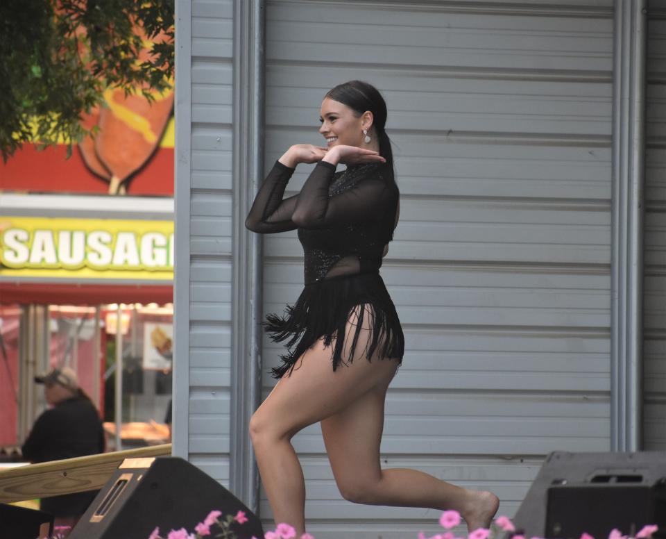 Emily Maran, a recent Tecumseh High School graduate, was named 2023 Lenawee County fair queen during Sunday's annual competition on the bandshell stage. Here, she performs an acrobatic dance routine during the talent portion of the contest.