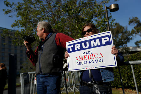 Supporters of Republican U.S. presidential candidate Donald Trump stand outside Hyatt Regency San Francisco Airport hotel during the California Republican Convention in Burlingame, California, U.S., April 29, 2016. REUTERS/Stephen Lam