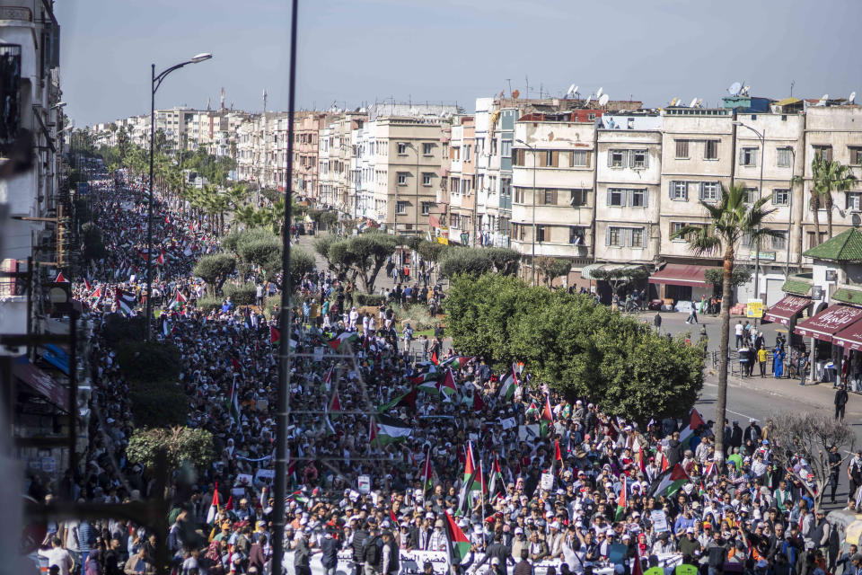 FILE - Thousands of Moroccans take part in a protest in solidarity with Palestinians in Gaza and against normalisation with Israel, in Casablanca, Morocco, Sunday, Oct. 29, 2023. Countries in the Middle East that have normalized or are considering normalizing relations with Israel are coming under growing public pressure to cut those ties because of Israel's war with Hamas. The protesters' demands present an uncomfortable dilemma for governments that have enjoyed the benefits of closer military and economic ties with Israel in recent years. (AP Photo/Mosa'ab Elshamy)