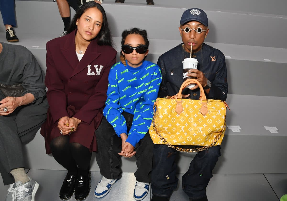 Pharrell Williams sits front row at the Dior Homme show in June 2023 with his family — and million dollar handbag   (Dave Benett/Getty Images)