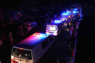 Lebanese Red Cross and Palestinian rescue team ambulances carrying dead bodies of those who were on a boat carrying migrants from Lebanon that sank in Syrian waters, crossing a border point between Lebanon and Syria, in Arida, north Lebanon, Sept. 23, 2022. Syria's health minister says several people have been killed from a boat that sank migrants from Lebanon off Syria's coast. The incident is the deadliest since a surging number of Lebanese, Syrians, and Palestinians have tried to flee crisis-hit Lebanon by sea to Europe. (AP Photo/Bilal Hussein)