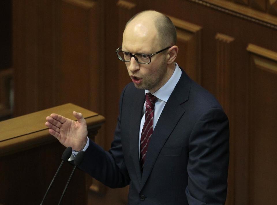 New prime minister Arseniy Yatsenyuk, speaks to lawmakers during a session at the Ukrainian parliament in Kiev, Thursday, Feb. 27, 2014. Ukrainian lawmakers chose Arseniy Yatsenyuk as the new prime minister. He will face the hugely complicated task of restoring stability in a country that is not only deeply divided politically but on the verge of financial collapse. The 39-year-old served as economy minister, foreign minister and parliamentary speaker before Yanukovych took office in 2010, and is widely viewed as a technocratic reformer who enjoys the support of the U.S. (AP Photo/Sergei Chuzavkov)