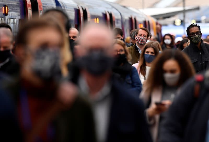 FILE PHOTO: People travel on public transport as COVID-19 restrictions continue to ease, in London