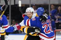 New York Rangers' Chris Kreider (20) fights with Pittsburgh Penguins' Mike Matheson (5) during the first period of Game 5 of an NHL hockey Stanley Cup first-round playoff series Wednesday, May 11, 2022, in New York. (AP Photo/Frank Franklin II)