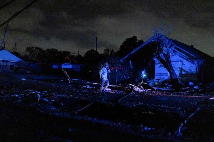 New Orleans resident John Jackson surveys the damage