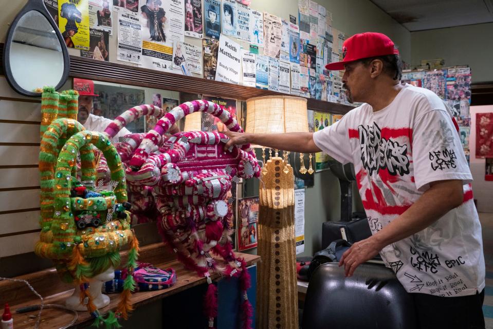 Keith Matthews, 69, of Detroit, shows his fantasy hair designs at Beauty Village salon in Detroit on Friday, Sept. 2, 2022. Matthews created the wigs in 2020 and is now revealing them at Hair Wars for the first time after a two-year break due to the pandemic.