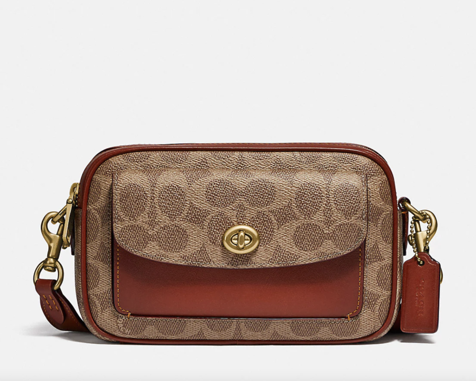 Willow Camera Bag In Signature Canvas in brown leather on white background (Photo via Coach)