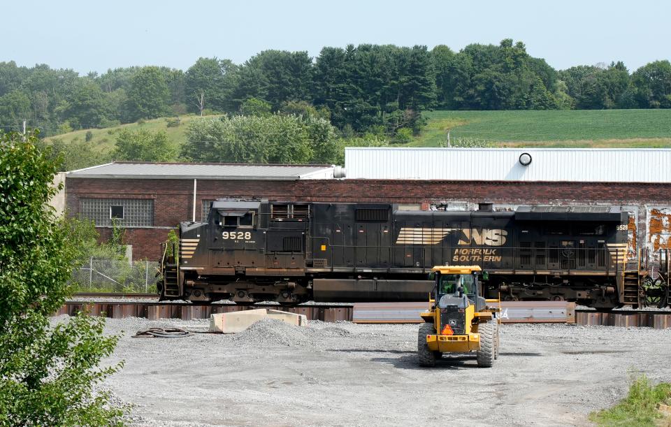 A Norfolk Southern train passes through East Palestine on July 25, near the site of a derailment in February.