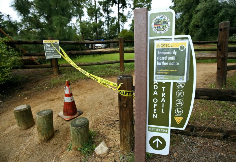 The La Canada Open Space Trail is now closed until further notice, due to the novel coronavirus COVID-19 restrictions, in La Canada Flintridge on Tuesday, March 24, 2020. Some walkers who came upon the closure were in disbelief.