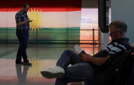 Passengers wait to depart on a Turkish Airlines flight at a gate at Erbil International airport, in Erbil, Iraq September 28, 2017. REUTERS/Marius Bosch
