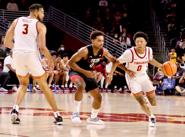 USC guard Boogie Ellis drives around CSUN guard Atin Wright.