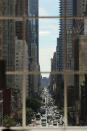 NEW YORK, NY - SEPTEMBER 19: Eighth Avenue is viewed from the 810-square-foot "living room" art installation by Japanese artist Tatzu Nishi which features the iconic 13-foot statue of Christopher Columbus on September 19, 2012 in New York City. Viewed as a piece of conceptual art, "Living Room", which sits 70-feet above ground level and is only accessible via a scaffold-encased staircase, has been temporarily built around the Columbus Monument in Columbus Circle. Beginning Thursday, up to 25 people at a time can enter the living room to view up close the 1892 marble figure of the Italian explorer. (Photo by Spencer Platt/Getty Images)