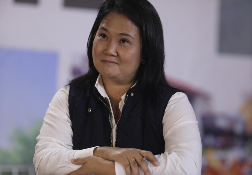 Presidential candidate Keiko Fujimori smiles during a press conference at her campaign headquarters after claiming electoral irregularities, in Lima, Peru, Monday, June 7, 2021, the day after the runoff election. With 95% of ballots tallied, presidential candidate Pedro Castillo has a narrow lead over Fujimori, according to official results. (AP Photo/Guadalupe Pardo)