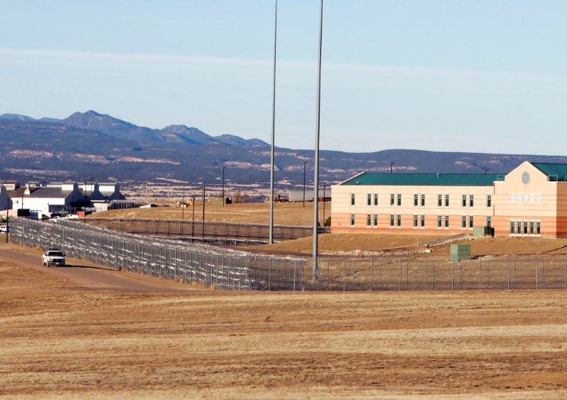 A patrol vehicle is seen along the fencing at the Federal Correctional Complex, including the Administrative Maximum Penitentiary or "Supermax" prison, in Florence, Colorado February 21,2007. REUTERS/Rick Wilking/File Photo