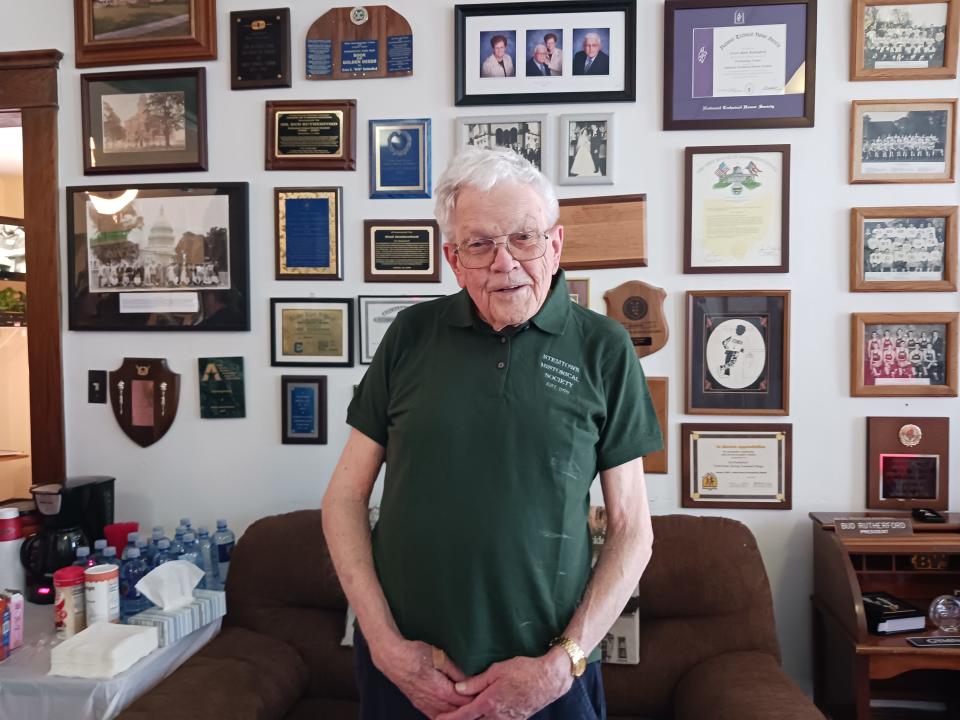 Bud Rutherford in front of his wall in the new Stemtown Museum in Green Springs.